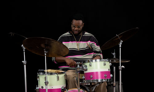Machado Mijiga plays the drums