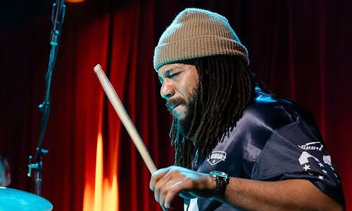 Malachi Whitson plays the drums 