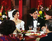 Still from the film The Wedding Banquet (1993) showing a wedding party at a dining table