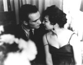 Still from the film Shadows (1961) showing a couple leaning in toward each other