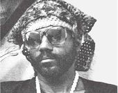 Black and white portrait of a man with sunglasses.