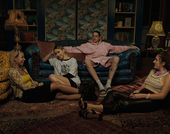 Still from the film "Bodies Bodies Bodies" (2022), showing four twenty-somethings relaxing in a living room