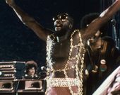 Isaac Hayes performing live in a still from the film "Wattstax" (1973)