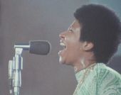 Aretha Franklin sings into microphone