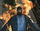 A man in a mask is on fire