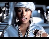 Missy Elliott, surrounded by hands holding cell phones to her face