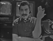 Ernie Kovacs speaking into a headset