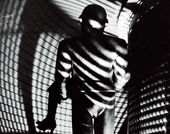 A robot carries a woman