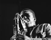 John Coltrane plays his sax