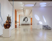 Installation view of a gallery with a large-scale photograph of Alice Coltrane