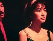 A woman turns her back to a man in a suit