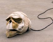 Brian Jungen, The Evening Redness in the West, 2006 (detail), baseballs, softballs, leather furniture, home theater system and DVDs, dimensions variable. 