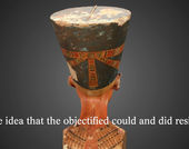 The back of a bust of Nefertiti, with a subtitle reading "the idea that the objectified could and did resist."